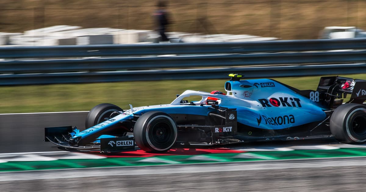 A Formula 1 car at speed over the kerbs during the Hungarian Grand Prix at the Hungaroring