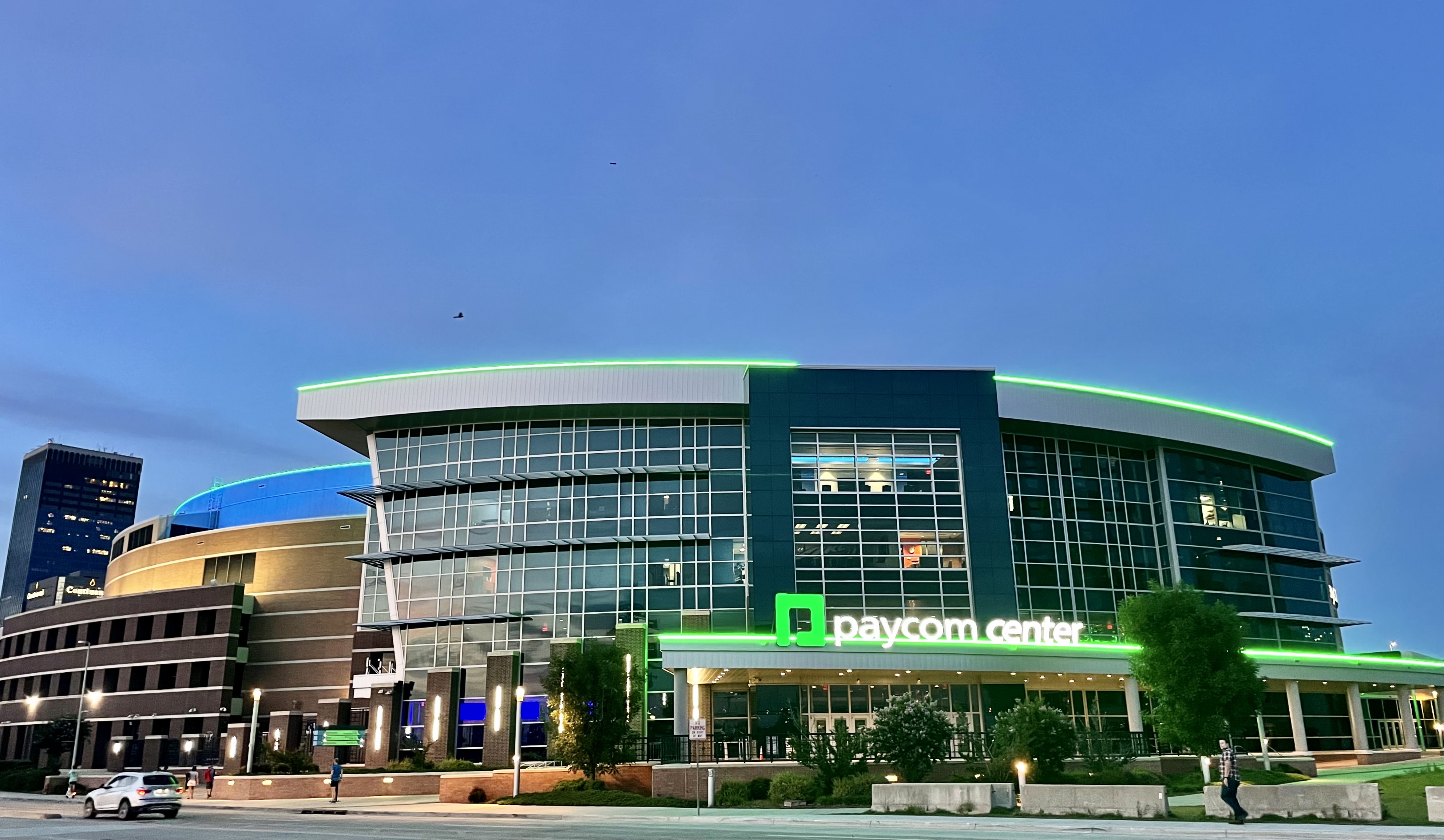 The Paycom Center in Oklahoma City lit up at dusk, host venue for UFC Fight Night