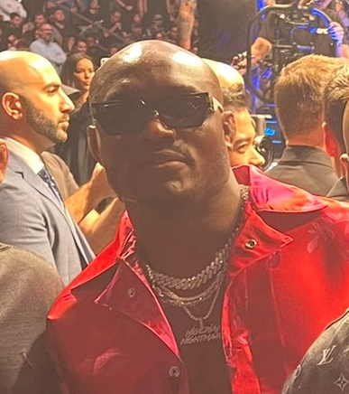 Kamaru Usman, wearing a jacket referencing his 'Nigerian Nightmare' nickname, at a UFC event